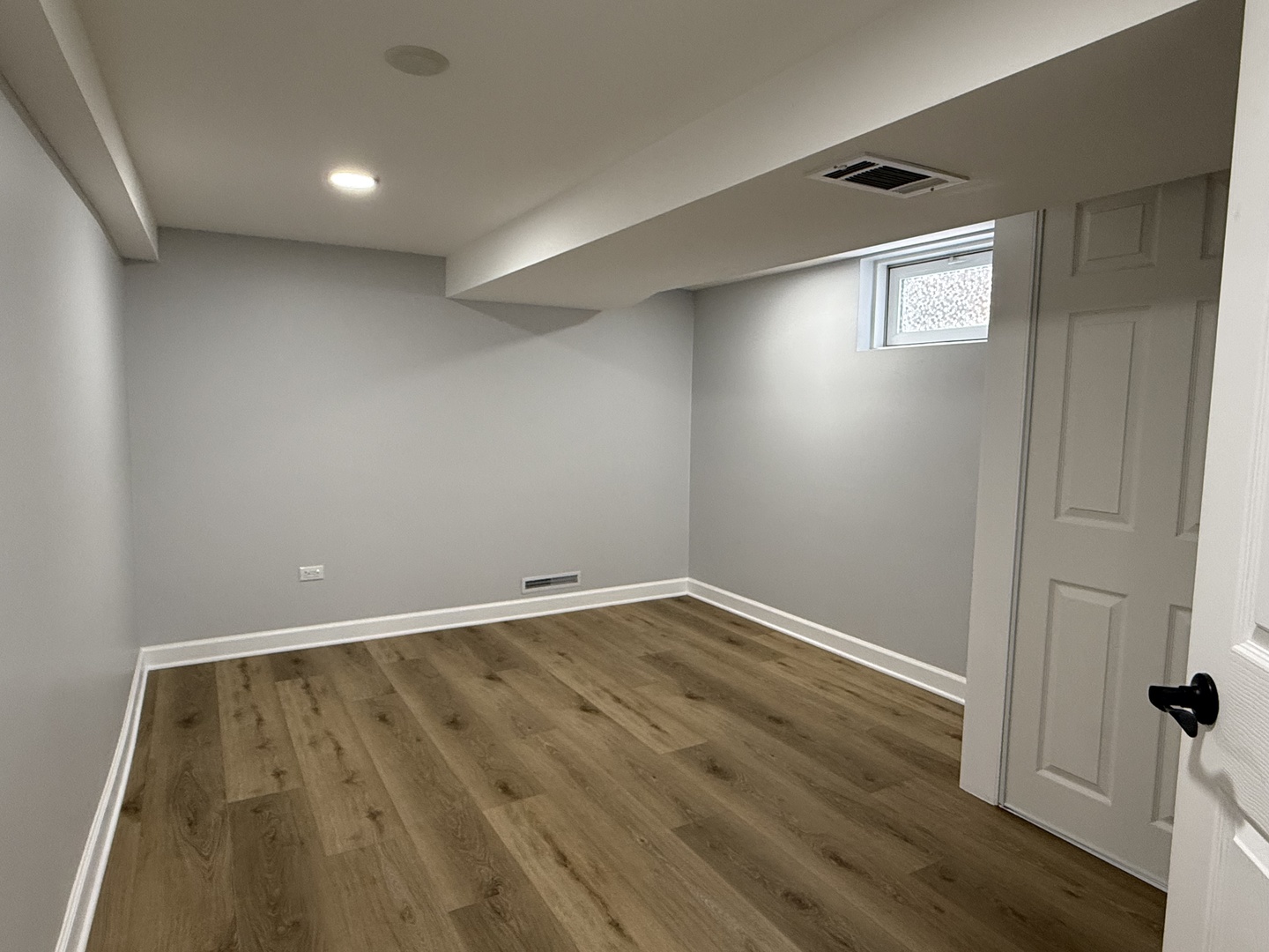 10061 Lacrosse Avenue Skokie, IL 60077 - Photo 13 of 19 an empty room with wooden floor and windows