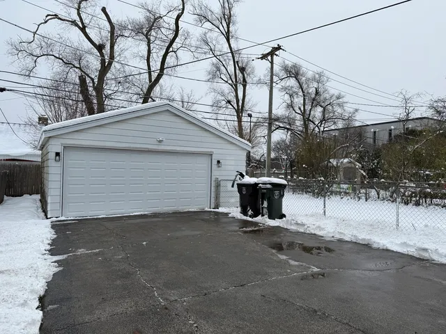 a view of a house with a snow in the yard