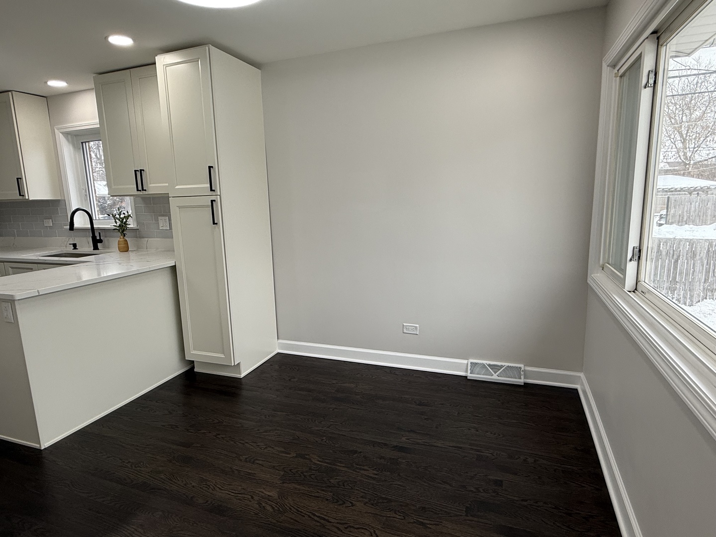10061 Lacrosse Avenue Skokie, IL 60077 - Photo 8 of 19 a view of a kitchen with a sink wooden floor and a window