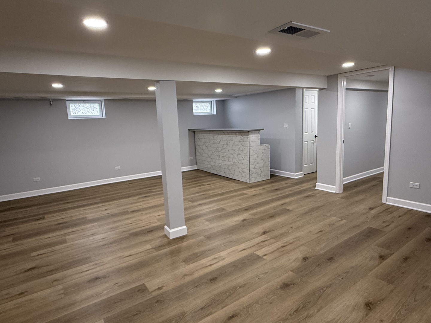 10061 Lacrosse Avenue Skokie, IL 60077 - Photo 10 of 19 an empty room with wooden floor and windows
