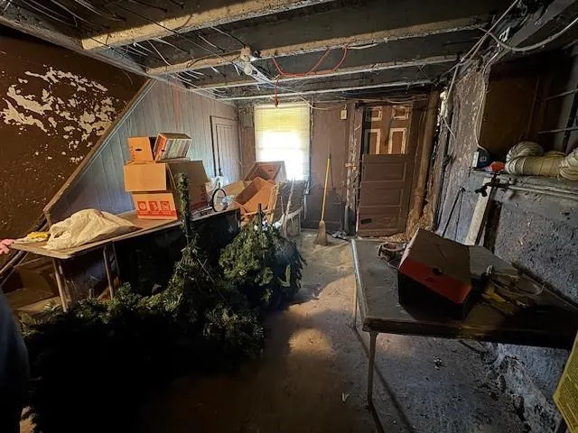 a view of living room with furniture and a window