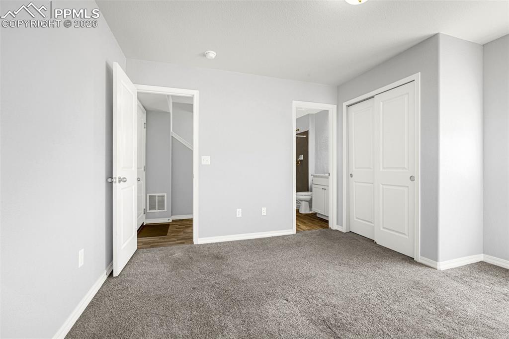 4432 Samaritan Loop Colorado Springs, CO 80916 - Photo 18 of 20 an empty room with closet and a bathroom