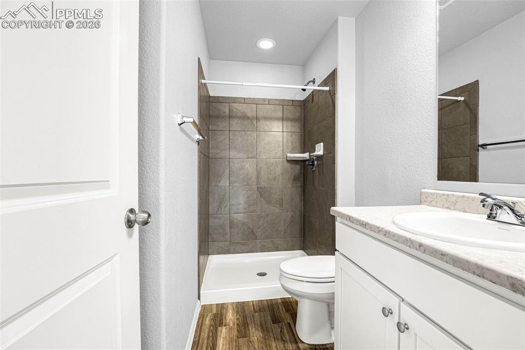 4432 Samaritan Loop Colorado Springs, CO 80916 - Photo 20 of 20 a bathroom with a sink a toilet and shower