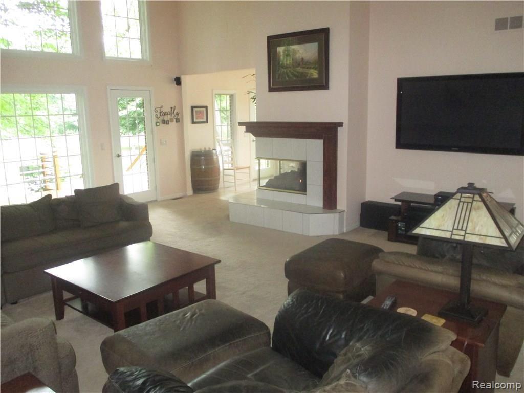 11465 Bruce N Lane Romeo, MI 48065 - Photo 24 of 43 Great Room with a French Door To Newer Deck and Fireplace!