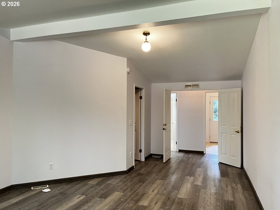 83411 Clear Lake Road Florence, OR 97439 - Photo 30 of 47 a view of a hallway with wooden floor