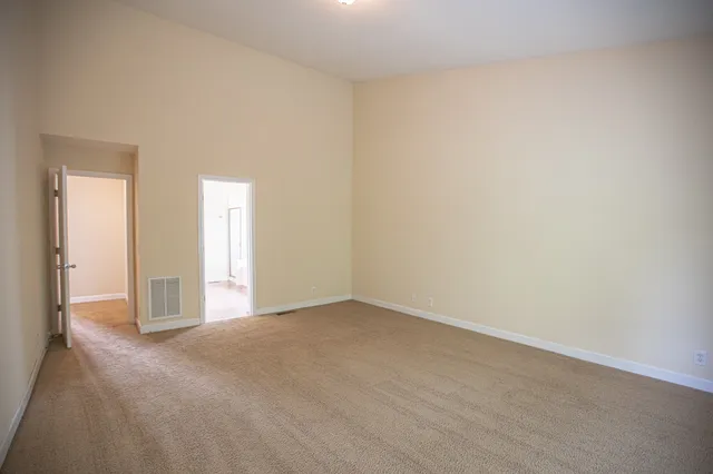 an empty room with closet area