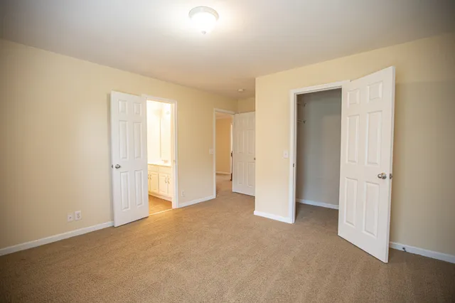 an empty room with closet area