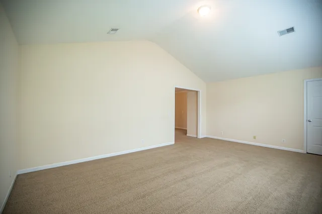 an empty room with a mirror