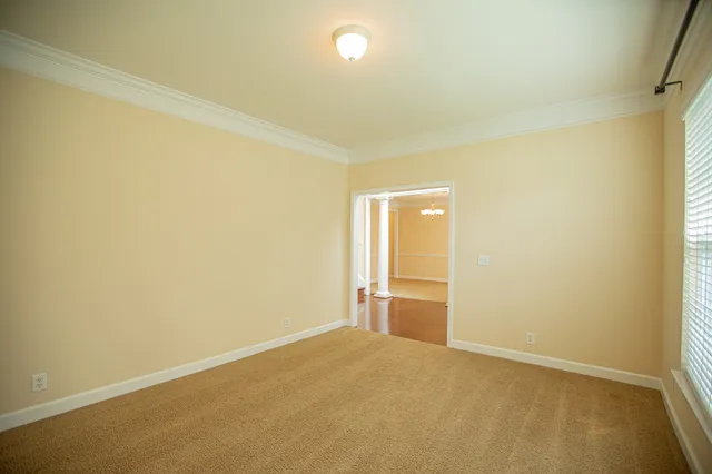 a view of an empty room and window