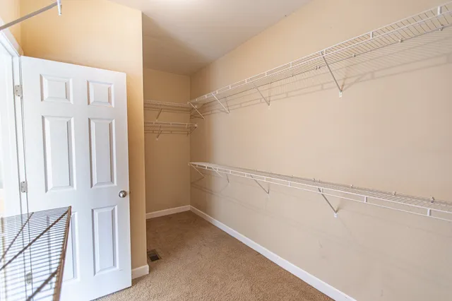 a white toilet sitting next to a window