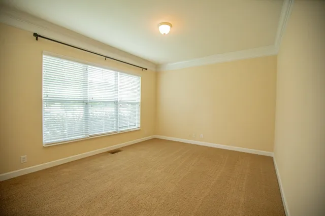 a white toilet sitting next to a bath tub
