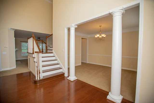 a bathroom with a granite countertop toilet sink and mirror