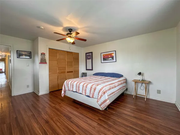 a spacious bedroom with a bed and a table