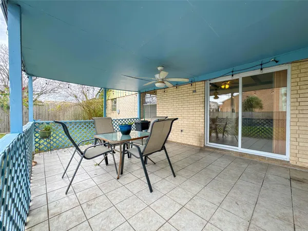 a view of an chairs and table in the balcony