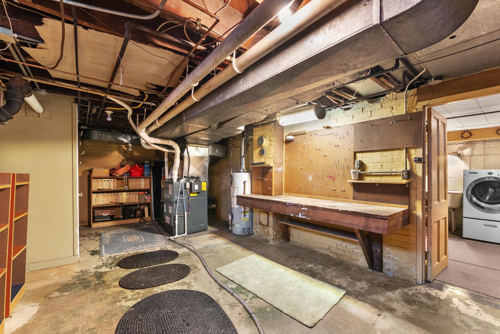 543 Roosevelt Road Kohler, WI 53044 - Photo 39 of 55 Workbench stays. Central air-2022. Updated GFA furnace. 2013-gas water heater.