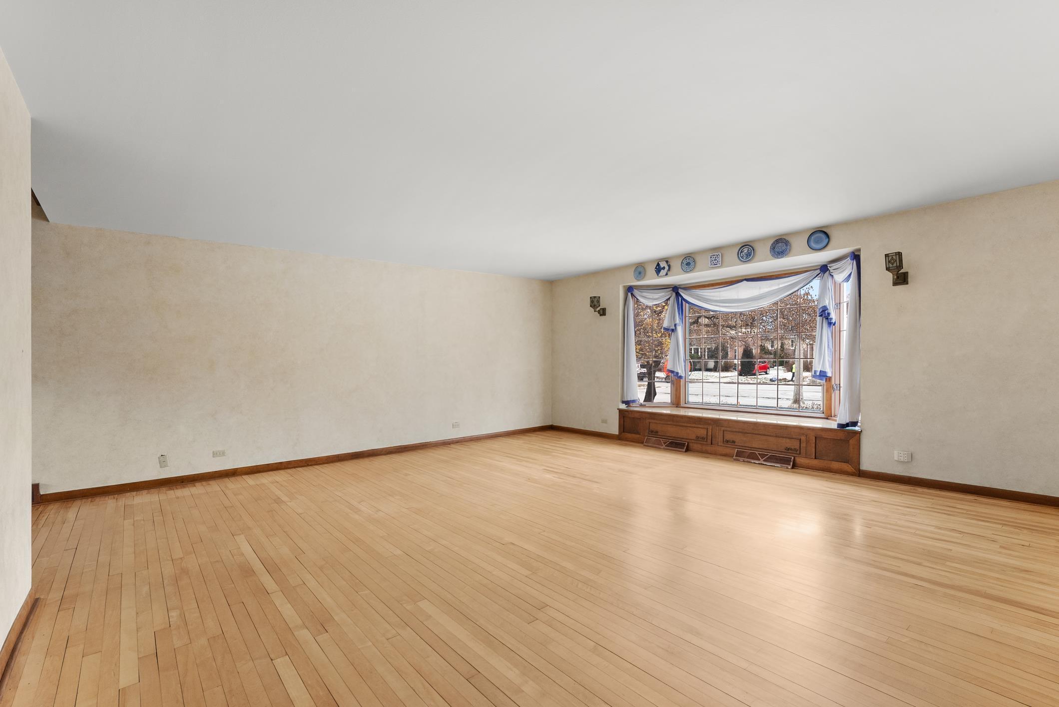 543 Roosevelt Road Kohler, WI 53044 - Photo 7 of 55 Wood floor. Area to the left opens to the dining room.