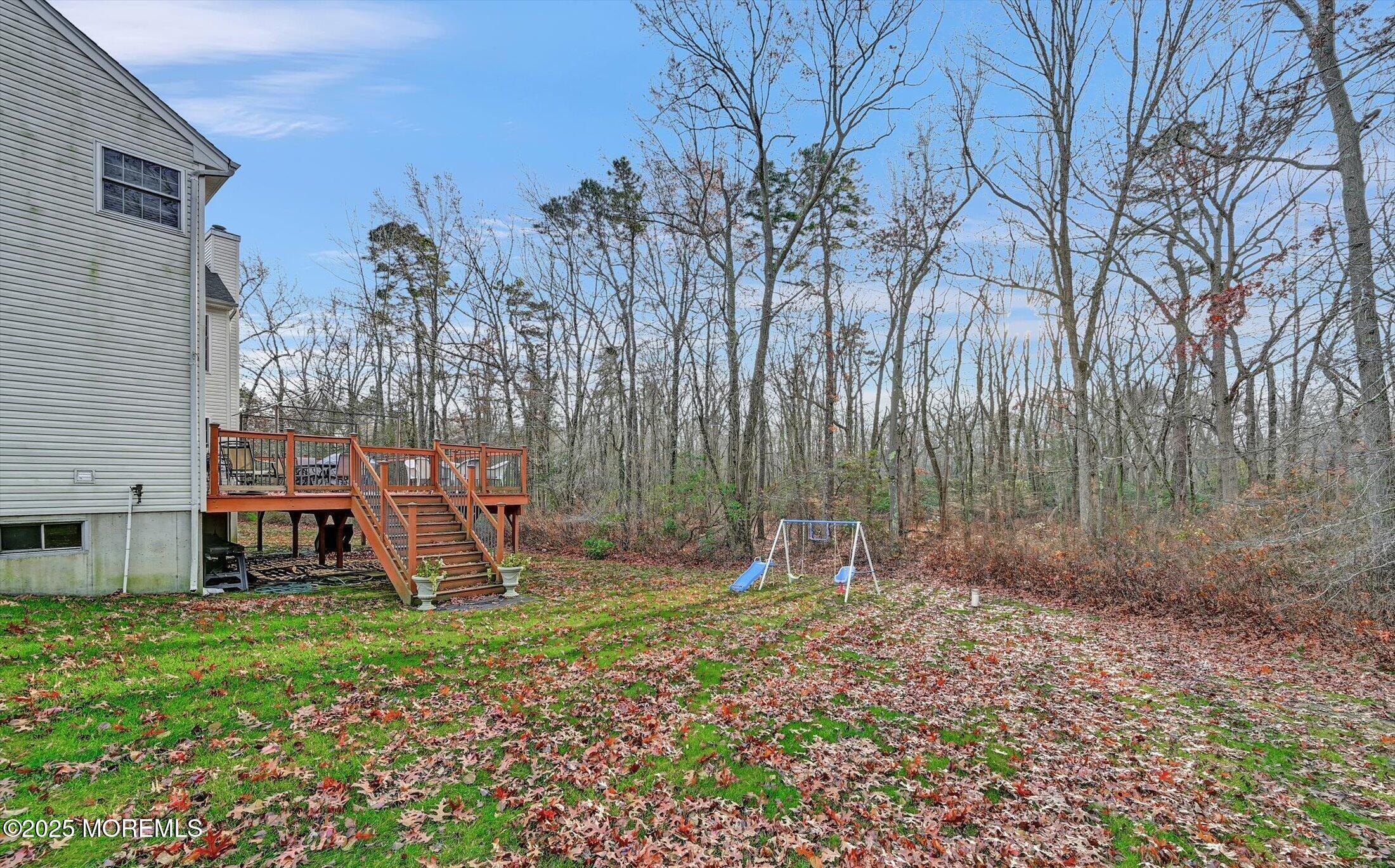 11 Craig Court Jackson, NJ 08527 - Photo 12 of 14 a view of outdoor space with playground and green space