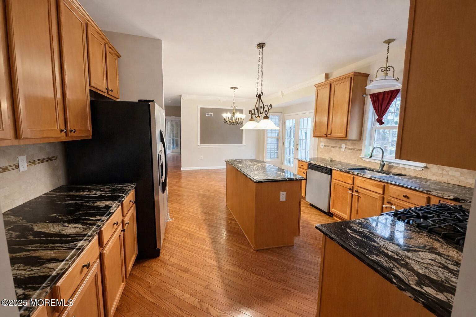 11 Craig Court Jackson, NJ 08527 - Photo 7 of 14 a kitchen with stainless steel appliances granite countertop a stove a sink and a refrigerator