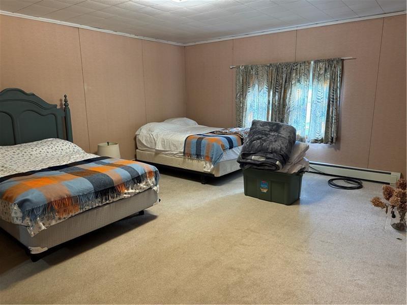 149 South Franklin Street Prospect, PA 16052 - Photo 14 of 25 a bedroom with a bed and a mirror