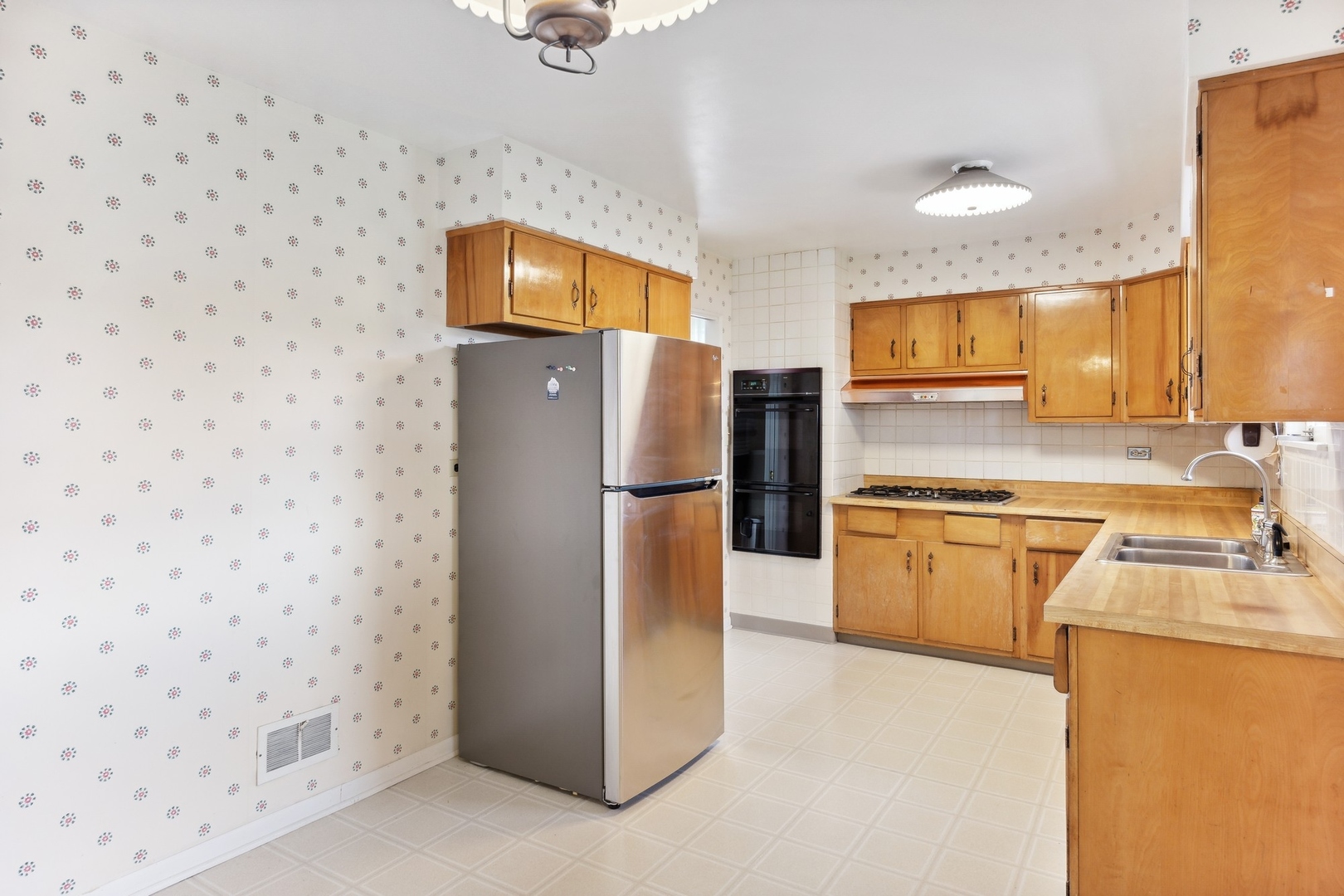 414 Shermer Road Glenview, IL 60025 - Photo 3 of 16 a kitchen with a refrigerator sink and stove