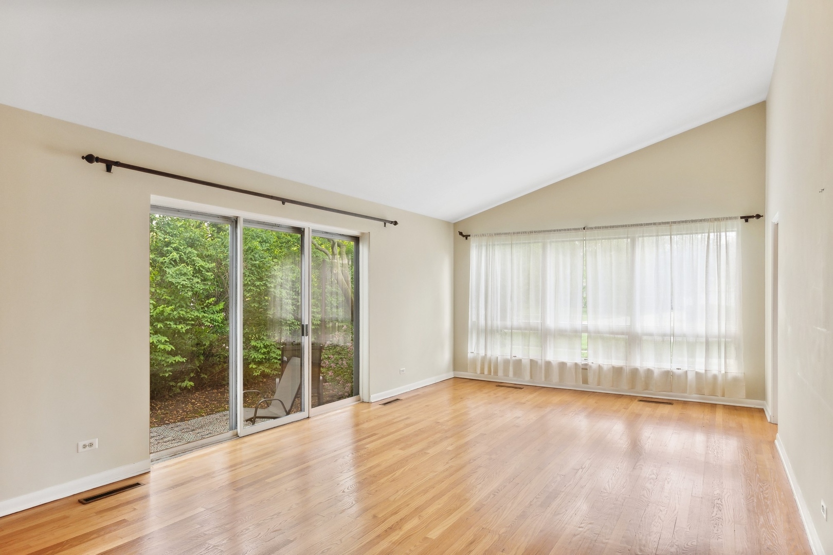 414 Shermer Road Glenview, IL 60025 - Photo 5 of 16 an empty room with wooden floor and windows