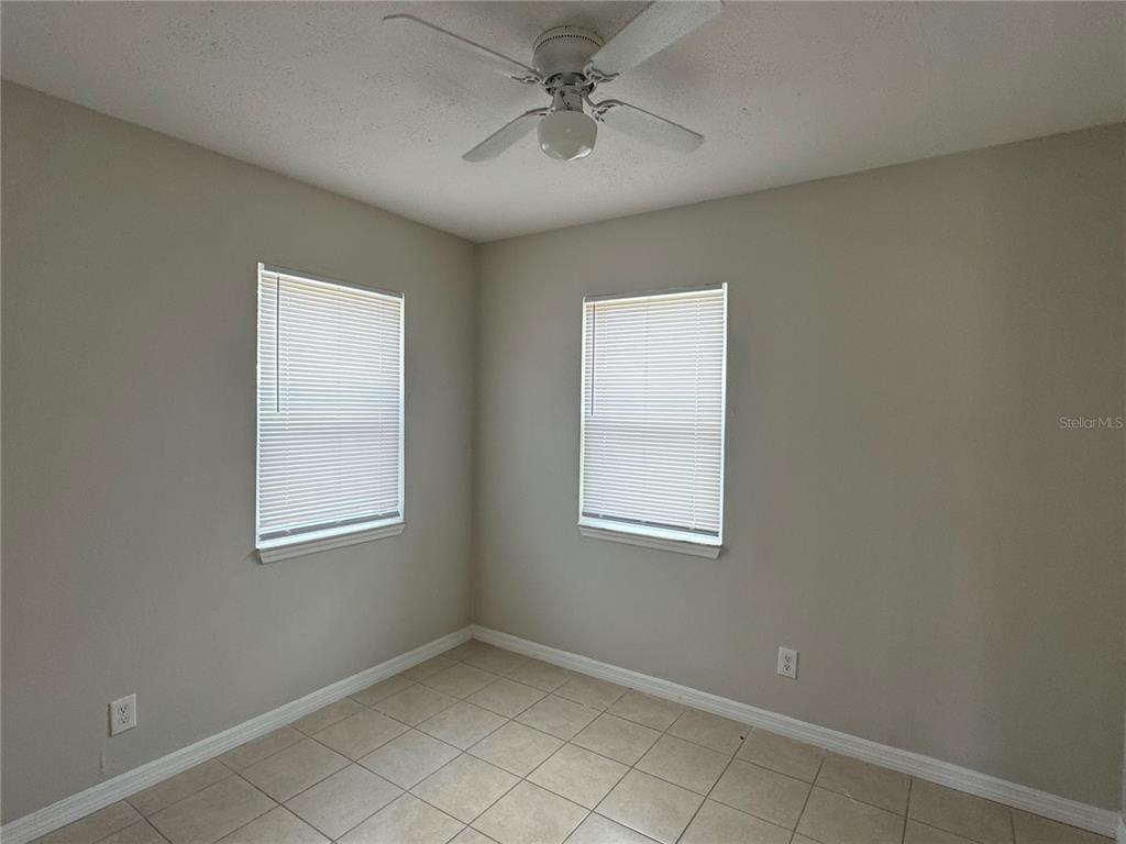 809 West Warren Street Plant City, FL 33563 - Photo 28 of 28 an empty room with windows and fan