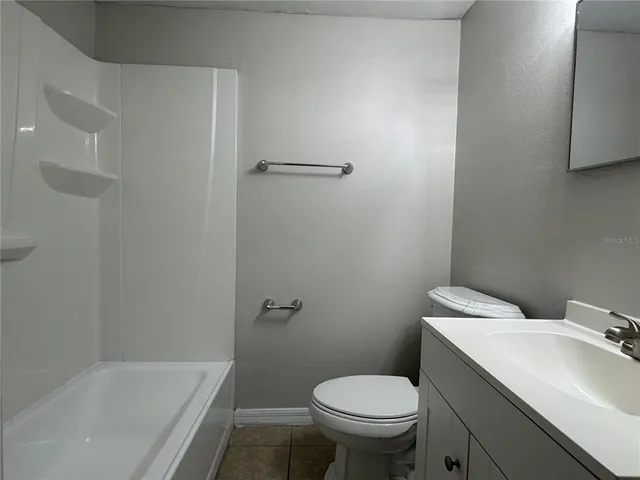 a bathroom with a sink and toilet
