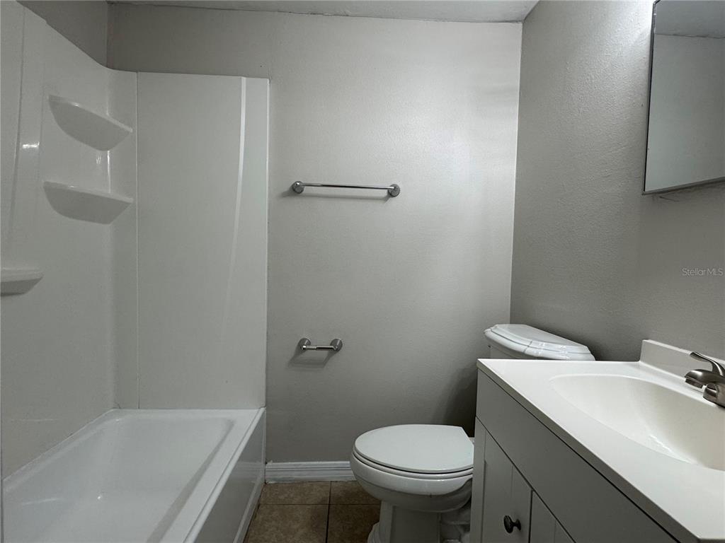 809 West Warren Street Plant City, FL 33563 - Photo 5 of 28 a bathroom with a sink and toilet