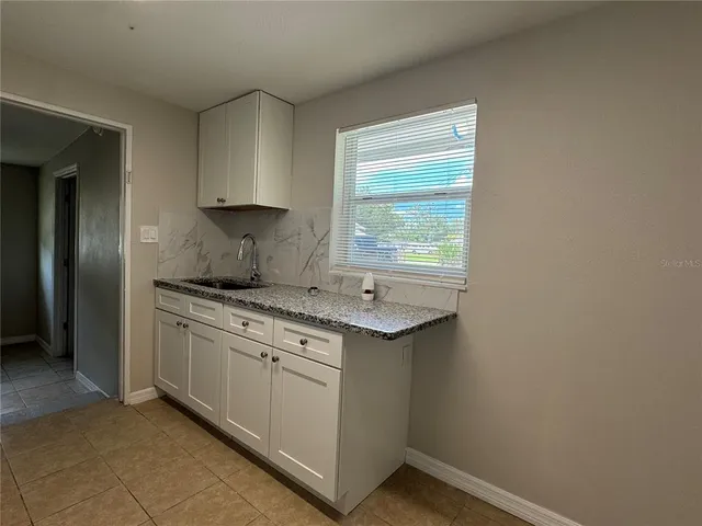 a kitchen with a stove and a sink