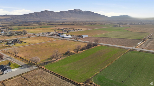 5601 West 15200 North Riverside, UT 84334 - Photo 7 of 10 Overview of rural landscape featuring abundant farmland and a mountain backdrop