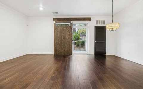 a kitchen with stainless steel appliances granite countertop a refrigerator a stove a sink and a microwave