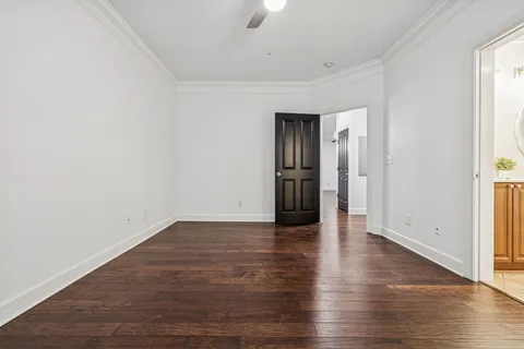 a bathroom with a double vanity sink toilet mirror and tub
