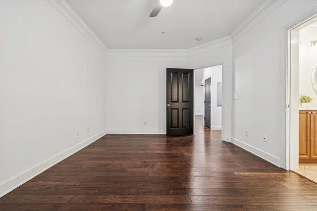 a bathroom with a double vanity sink toilet mirror and tub