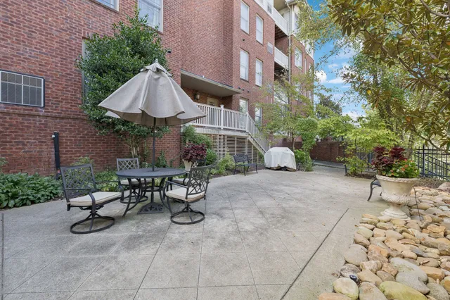 a view of a backyard with sitting area