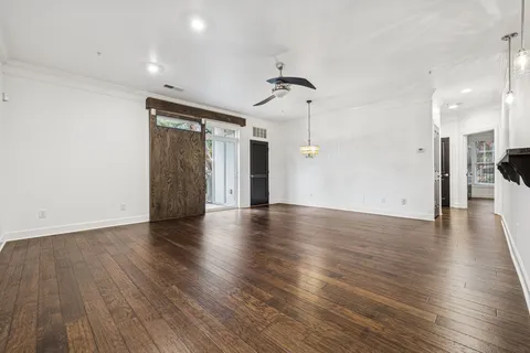 a view of a kitchen with a refrigerator and a window