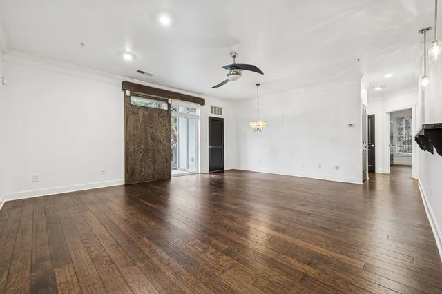 a view of a kitchen with a refrigerator and a window
