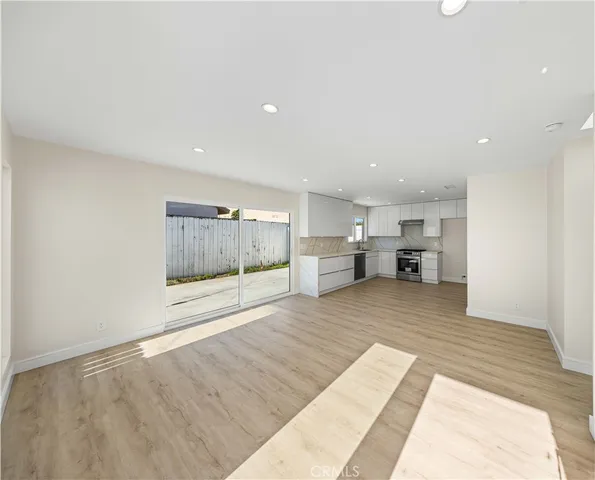 a view of kitchen and kitchen with furniture wooden floor and window