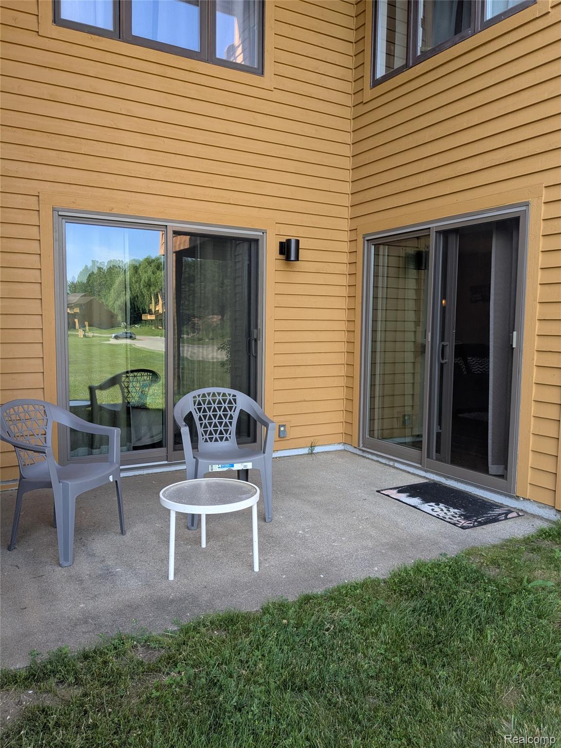4749 South Pleasantview Road, Unit 37 Harbor Springs, MI 49740 - Photo 23 of 44 Outdoor Patio with Cement Pad