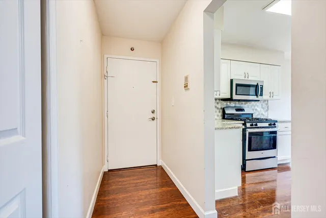 a kitchen with a refrigerator stove and microwave