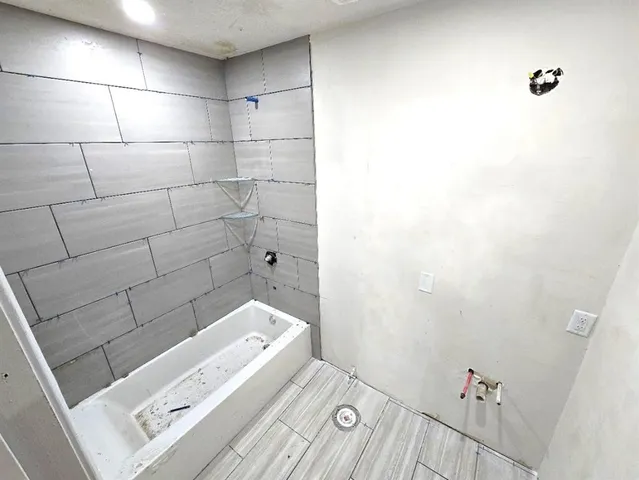 a bathroom with a sink and a shower