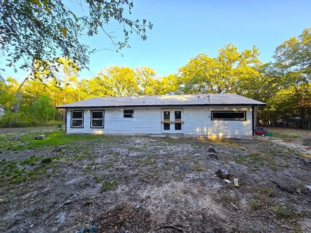 a house view with a backyard space