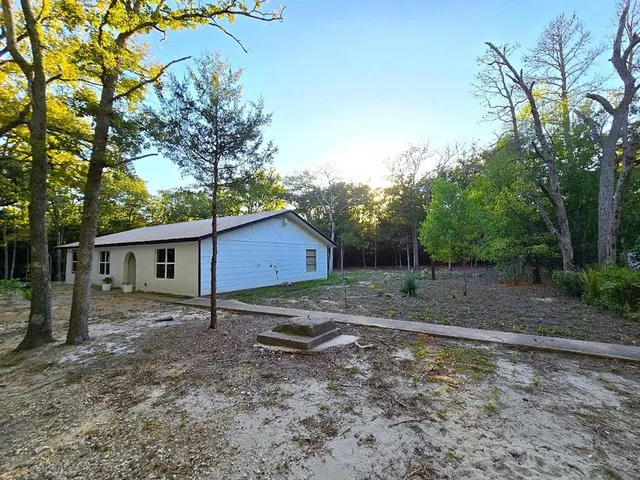 a house view with a backyard space