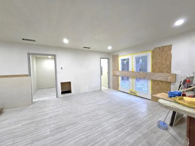 a kitchen with stainless steel appliances granite countertop a stove a sink a refrigerator and a microwave