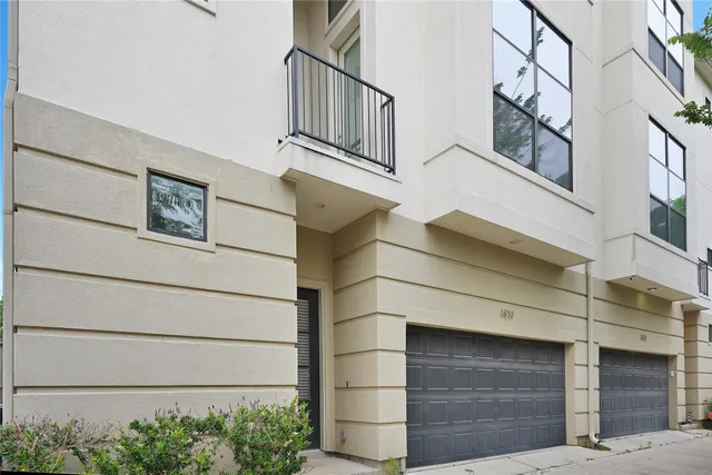 a view of a building with a garage