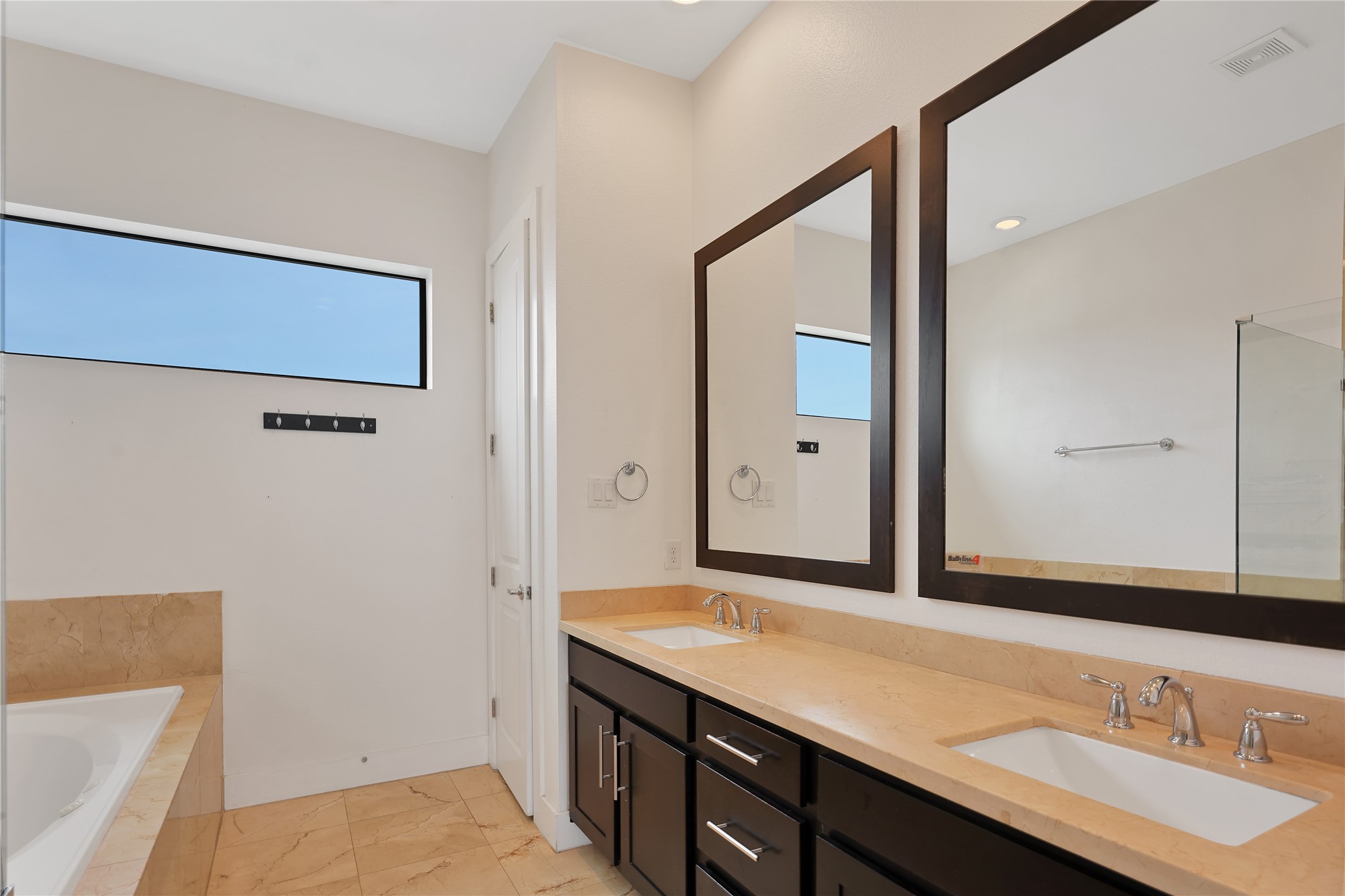 1810 Thompson Street Houston, TX 77007 - Photo 14 of 20 a bathroom with a sink a mirror and a shower