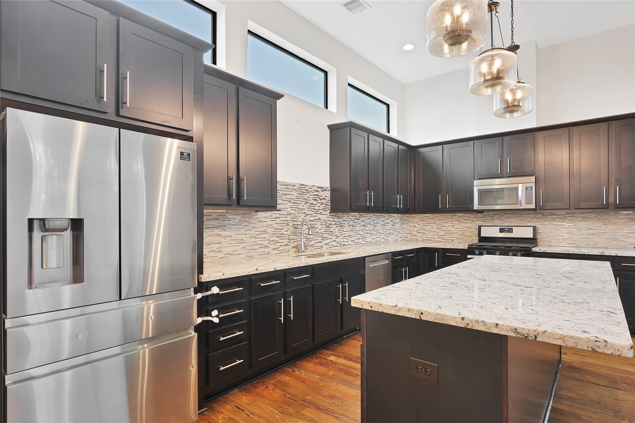 1810 Thompson Street Houston, TX 77007 - Photo 4 of 20 a kitchen with stainless steel appliances granite countertop a refrigerator a sink dishwasher a stove and a refrigerator