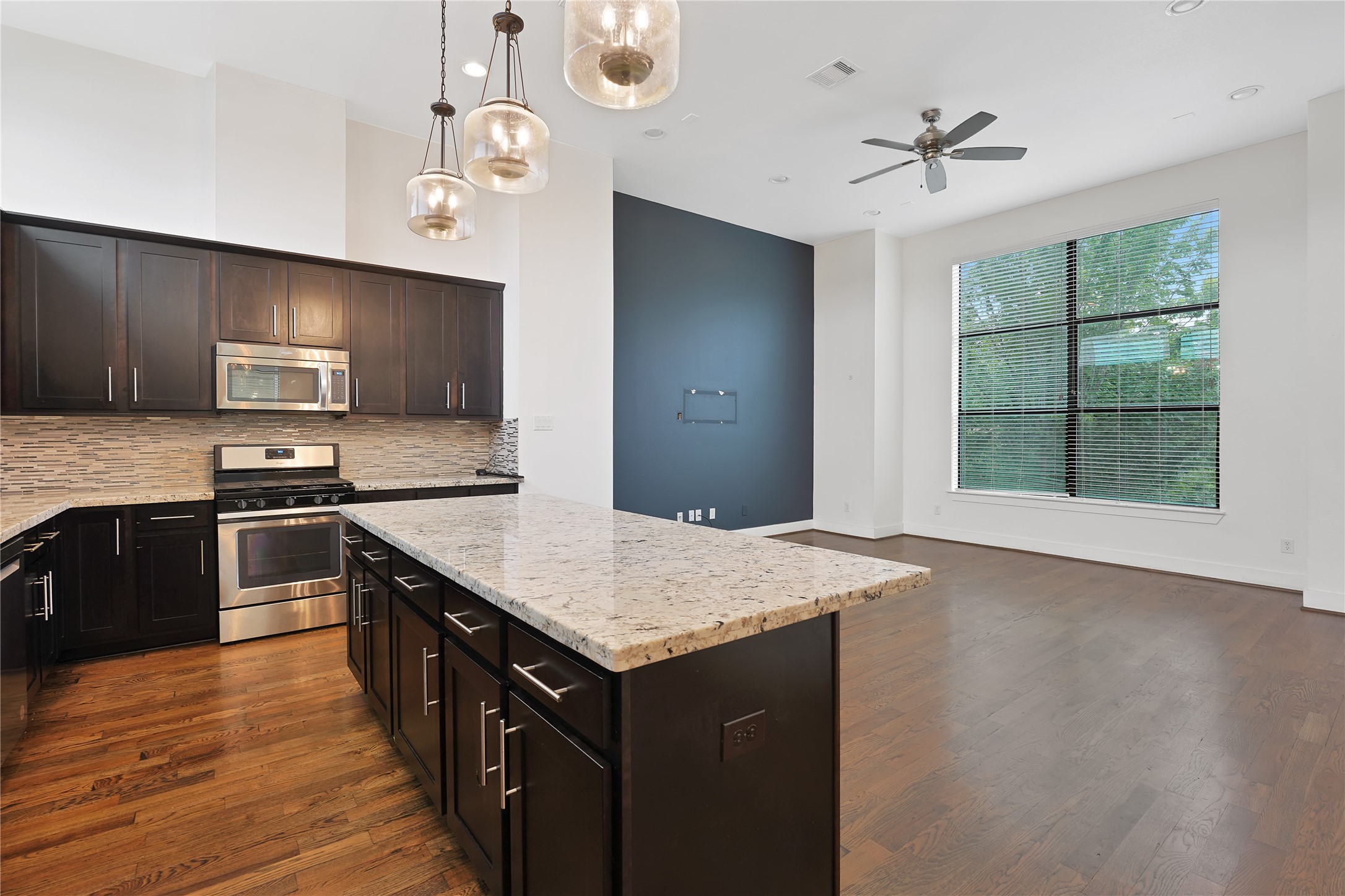 1810 Thompson Street Houston, TX 77007 - Photo 6 of 20 a kitchen with a stove a sink and a refrigerator