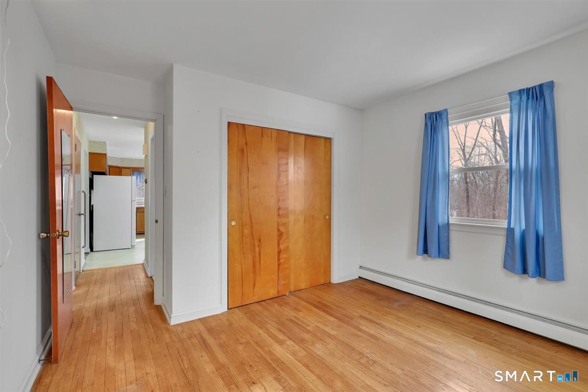 47 Park Road Colchester, CT 06415 - Photo 14 of 31 Flexible main-floor living space, perfect for a quiet home office or secondary bedroom.