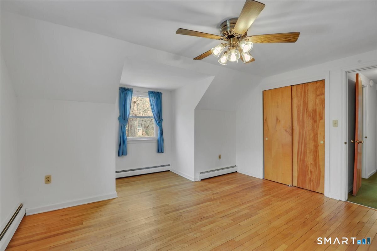 47 Park Road Colchester, CT 06415 - Photo 18 of 31 The private door at the landing you see in the hallway is a great feature allowing you to isolate the upper level bedrooms for added peace, quiet, and privacy.