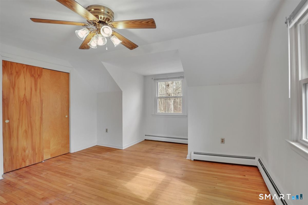 47 Park Road Colchester, CT 06415 - Photo 21 of 31 Another second floor bedroom with great space and featuring hardwood floors.